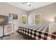 Simple bedroom design with light colored walls, carpet flooring, and modern furniture at 10304 Stallion Way, Bahama, NC 27503