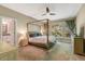Bedroom features a canopy bed, large windows and a ceiling fan at 10304 Stallion Way, Bahama, NC 27503