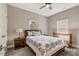Cozy bedroom with neutral walls, carpet flooring, ceiling fan, and furnishings at 10304 Stallion Way, Bahama, NC 27503
