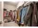 Spacious walk-in closet with carpet floors and built-in shelving for ample storage at 10304 Stallion Way, Bahama, NC 27503