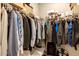 Walk-in closet featuring ample hanging storage with wire shelving at 10304 Stallion Way, Bahama, NC 27503
