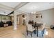 Open-concept dining room features a modern light fixture and flows into the living area at 10304 Stallion Way, Bahama, NC 27503