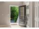 Charming front door with glass inserts allows natural light into the home and a view of the outdoors at 10304 Stallion Way, Bahama, NC 27503