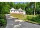 Charming two-story home with a well-manicured lawn, and a concrete driveway at 10304 Stallion Way, Bahama, NC 27503