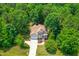 Aerial view of a house with mature trees and landscaping at 1033 Cabin Hill Way, Garner, NC 27529