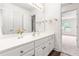 A well-lit bathroom with a white vanity, modern fixtures, and a view into another room at 1033 Cabin Hill Way, Garner, NC 27529