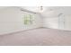 Spacious bedroom with large window and a ceiling fan at 1033 Cabin Hill Way, Garner, NC 27529