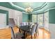 Bright dining room featuring hardwood floors, soft colors, and staircase access at 1033 Cabin Hill Way, Garner, NC 27529