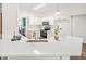Clean kitchen featuring white cabinets, modern appliances, and sleek quartz countertops at 1033 Cabin Hill Way, Garner, NC 27529