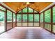 Wood screened porch with a vaulted ceiling and ceiling fan at 1033 Cabin Hill Way, Garner, NC 27529