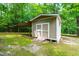 Exterior view of shed featuring double doors and an awning at 1033 Cabin Hill Way, Garner, NC 27529