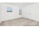 Bright bedroom with neutral carpet, white walls, a double window, and closet with double doors at 105 Mable Court # 10, Lillington, NC 27546