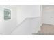 Hallway featuring carpeted stairs and a side window with a view to the exterior at 105 Mable Court # 10, Lillington, NC 27546