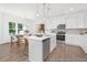 Open kitchen with island, stainless steel appliances, and adjacent dining area at 105 Mable Court # 10, Lillington, NC 27546