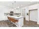 Bright kitchen with white cabinets, marble countertops, and pendant lighting at 105 Mable Court # 10, Lillington, NC 27546