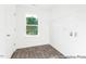 Functional laundry room with wood-look flooring, and a window for natural light at 105 Mable Court # 10, Lillington, NC 27546
