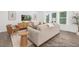 Cozy living room featuring a plush sofa, area rug, and bright windows at 105 Mable Court # 10, Lillington, NC 27546