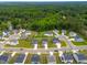 Aerial view of a residential neighborhood surrounded by lush greenery and mature trees at 110 Hickory Grove Dr, Sanford, NC 27330