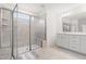 Bright bathroom with large tile shower with glass door and double sink vanity at 110 Hickory Grove Dr, Sanford, NC 27330