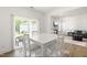 Cozy dining area with sliding glass doors leads to the backyard and living area at 110 Hickory Grove Dr, Sanford, NC 27330