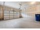 A clean, unfinished two-car garage featuring an automatic door at 110 Hickory Grove Dr, Sanford, NC 27330
