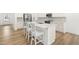 Bright, modern kitchen with quartz countertops, stainless appliances, and herringbone backsplash for the home chef at 110 Hickory Grove Dr, Sanford, NC 27330