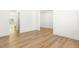 Open floor plan with hardwood floors and neutral walls creates a modern and inviting space at 110 Hickory Grove Dr, Sanford, NC 27330