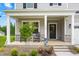 Inviting front porch with rocking chairs creates a welcoming entrance to this charming home at 110 Hickory Grove Dr, Sanford, NC 27330