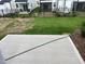 Backyard patio with grass and a black metal fence in the background at 1116 Merlot Hills Ln, Durham, NC 27704