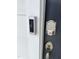 Up-close look at front door with smart lock and Ring doorbell for added security and convenience at 1116 Merlot Hills Ln, Durham, NC 27704