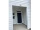 Front porch entrance with modern black door and a clear view of the house number 1116 at 1116 Merlot Hills Ln, Durham, NC 27704