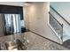 Modern kitchen featuring stainless steel appliances, granite countertops, and stairs to the next level at 1116 Merlot Hills Ln, Durham, NC 27704