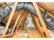 Unfinished attic with exposed wooden beams and insulation at 114 Bonaparte Dr, Hillsborough, NC 27278