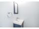 Modern bathroom features a sleek sink, contemporary faucet, and a stylish mirror at 114 Bonaparte Dr, Hillsborough, NC 27278