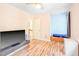 Bright bedroom with hardwood floors, built-in bench, and modern ceiling fan at 114 Bonaparte Dr, Hillsborough, NC 27278