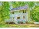 Exterior view of home featuring fenced in yard, deck, and grey siding at 114 Bonaparte Dr, Hillsborough, NC 27278