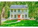 Charming two-story home with a bright red front door and landscaped front yard at 114 Bonaparte Dr, Hillsborough, NC 27278