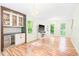 Spacious living room featuring a stylish bar area, hardwood floors, and modern fixtures at 114 Bonaparte Dr, Hillsborough, NC 27278