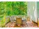 Enjoy outdoor dining on the brick patio with a table, chairs, and privacy fence at 114 Bonaparte Dr, Hillsborough, NC 27278