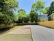 A spacious backyard with a wood fence, rock landscaping, and patio at 114 N Guthrie Ave, Durham, NC 27703