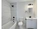 Modern bathroom featuring a tub with marble tile, modern vanity and fixtures at 114 N Guthrie Ave, Durham, NC 27703