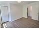 A spacious bedroom with hardwood flooring and a large double-door closet at 114 N Guthrie Ave, Durham, NC 27703