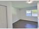 Bedroom featuring neutral walls, new flooring, natural light and closet at 114 N Guthrie Ave, Durham, NC 27703