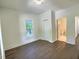 Bedroom featuring neutral walls, new flooring, natural light and closet at 114 N Guthrie Ave, Durham, NC 27703