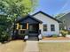 Charming renovated home with a covered porch and yellow posts at 114 N Guthrie Ave, Durham, NC 27703