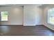 Bright living room featuring recessed lighting and gleaming hardwood floors and windows at 114 N Guthrie Ave, Durham, NC 27703