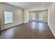 Bright and spacious living room featuring recessed lighting and gleaming hardwood floors at 114 N Guthrie Ave, Durham, NC 27703