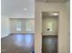 Bright and spacious living room with new vinyl floors and natural light from large windows at 114 N Guthrie Ave, Durham, NC 27703