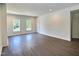 Large open living room with wood floors at 114 N Guthrie Ave, Durham, NC 27703