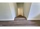 View of staircase with vinyl floors leading into lower level at 114 N Guthrie Ave, Durham, NC 27703